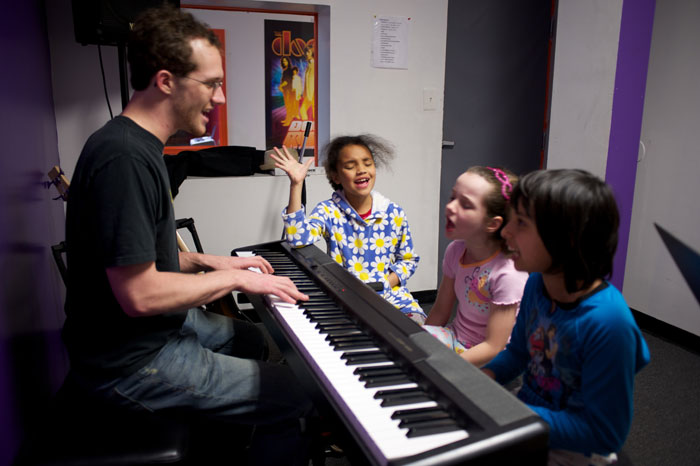 excited students at our music school franchises